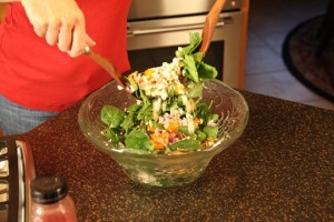 Toss Spinach Salad Ingredients Together