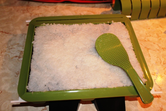 Spreading Rice on Tray for Sushi